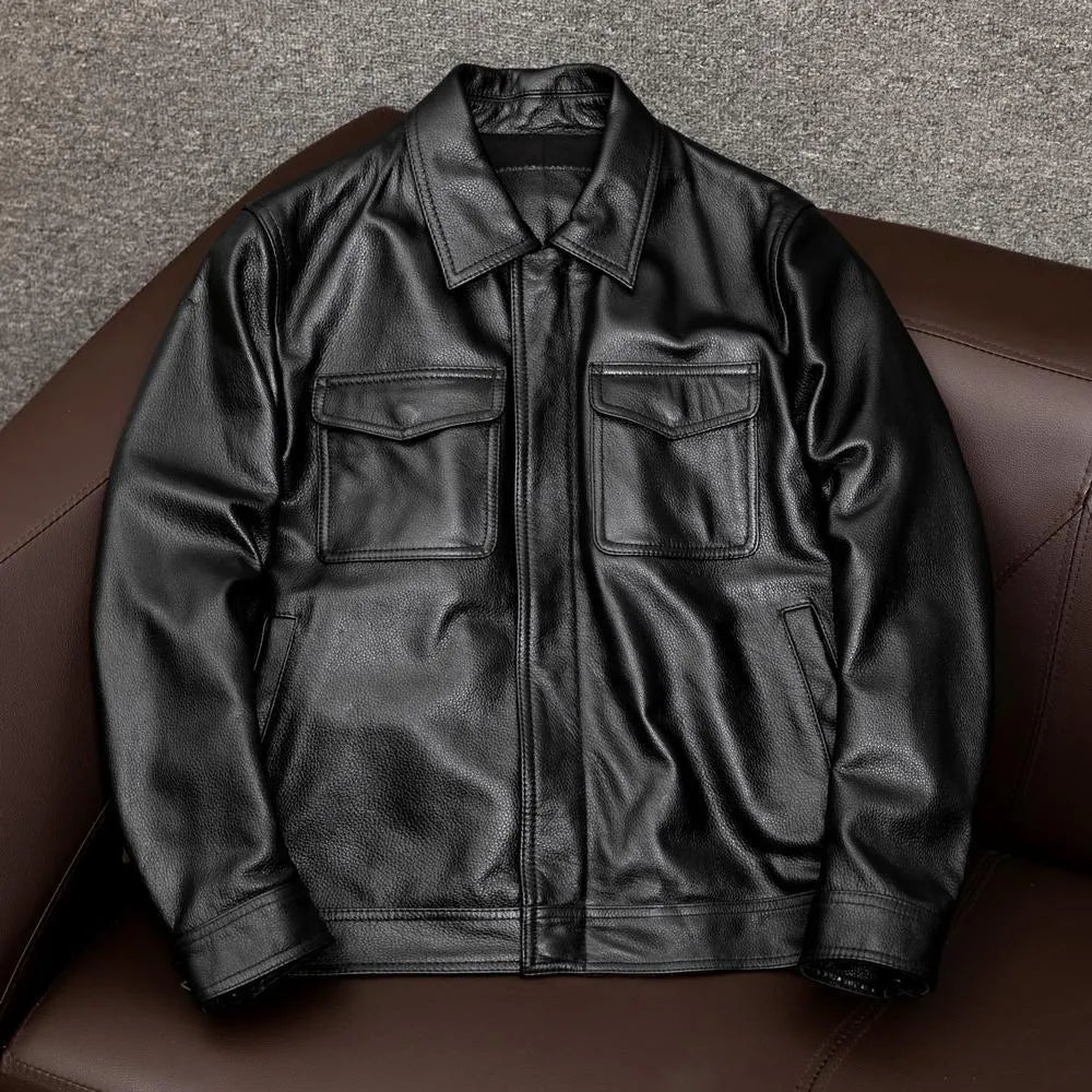 A man's black plus size PU leather jacket with a lapel and side pockets, shown on a hanger.