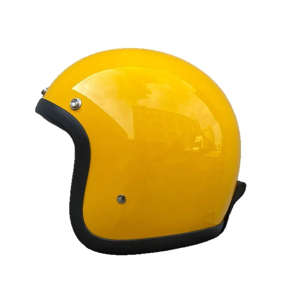 Retro-style open-face motorcycle helmet in fibreglass, shown in a choice of colours including Cement Grey and Matte Black Flower.