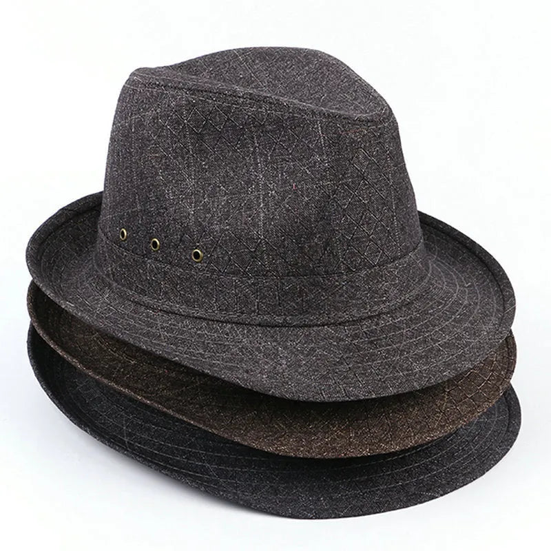 Classic brown fedora hat with structured crown and wide brim on a wooden stand