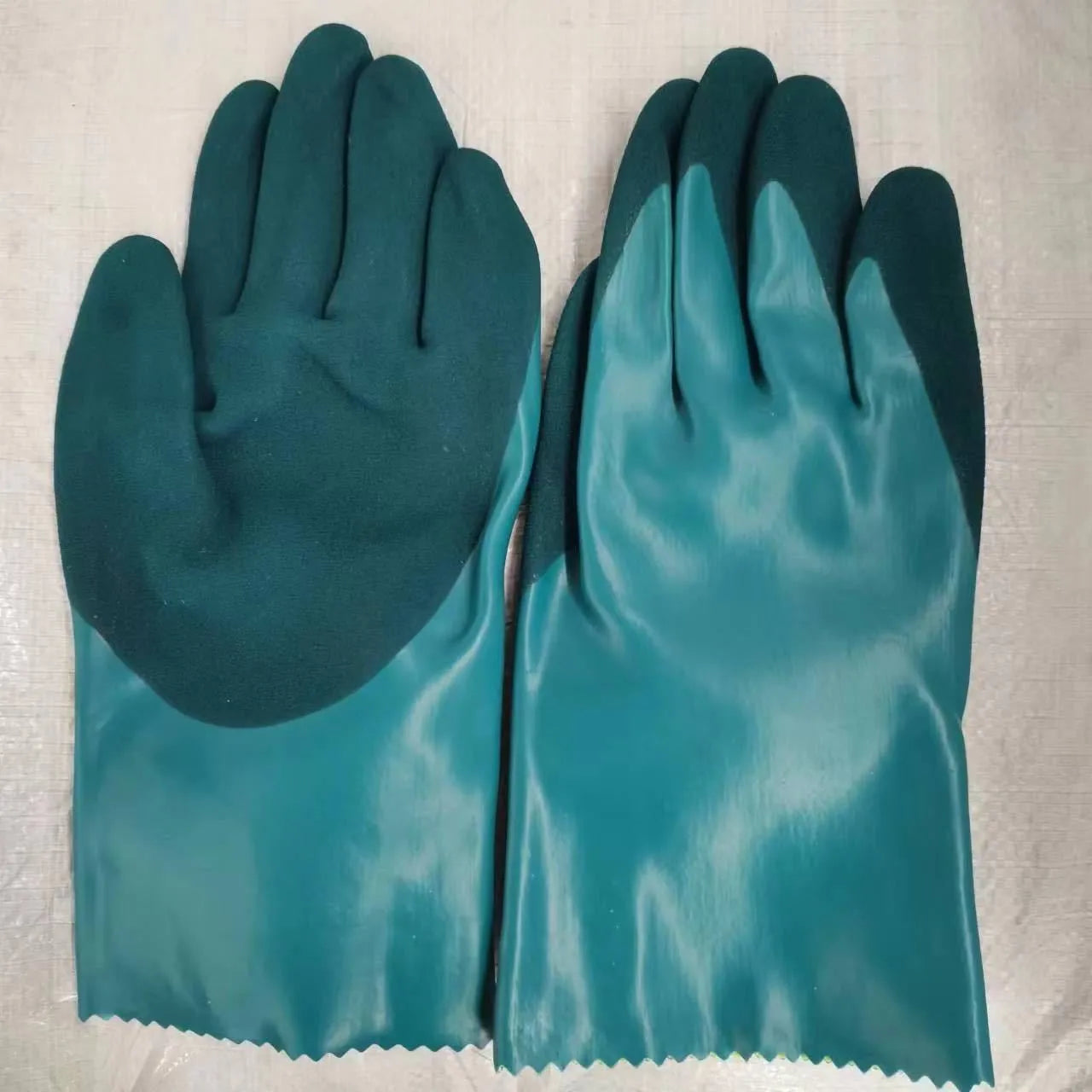 Navy blue women's nitrile gloves shown in short and lengthened sleeve versions for fishing and work.