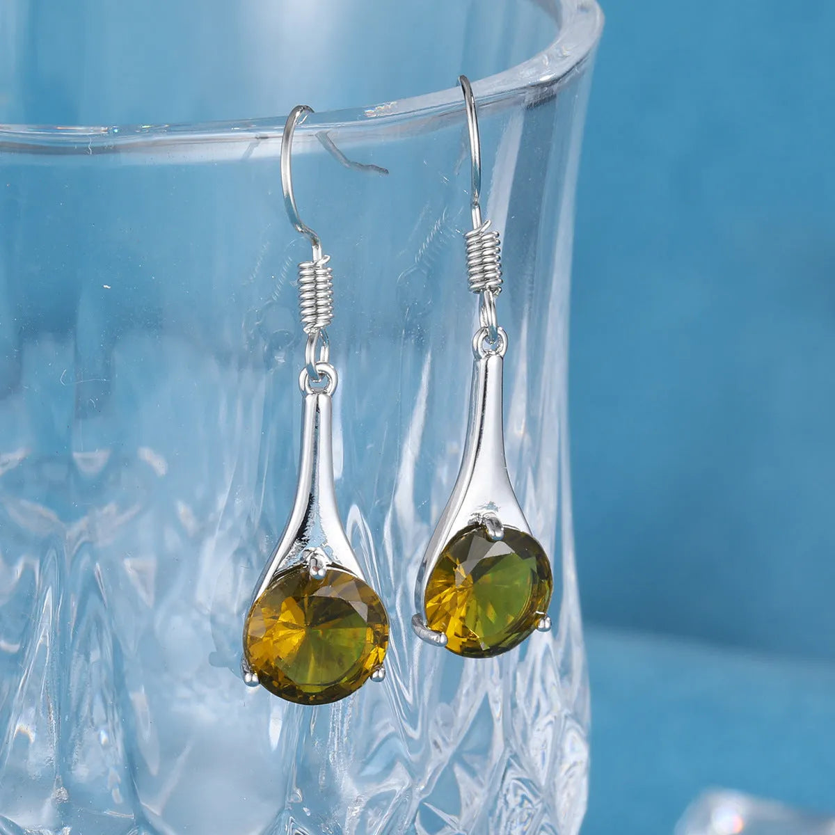 Olive green topaz drop earrings with water drop shape and retro style design