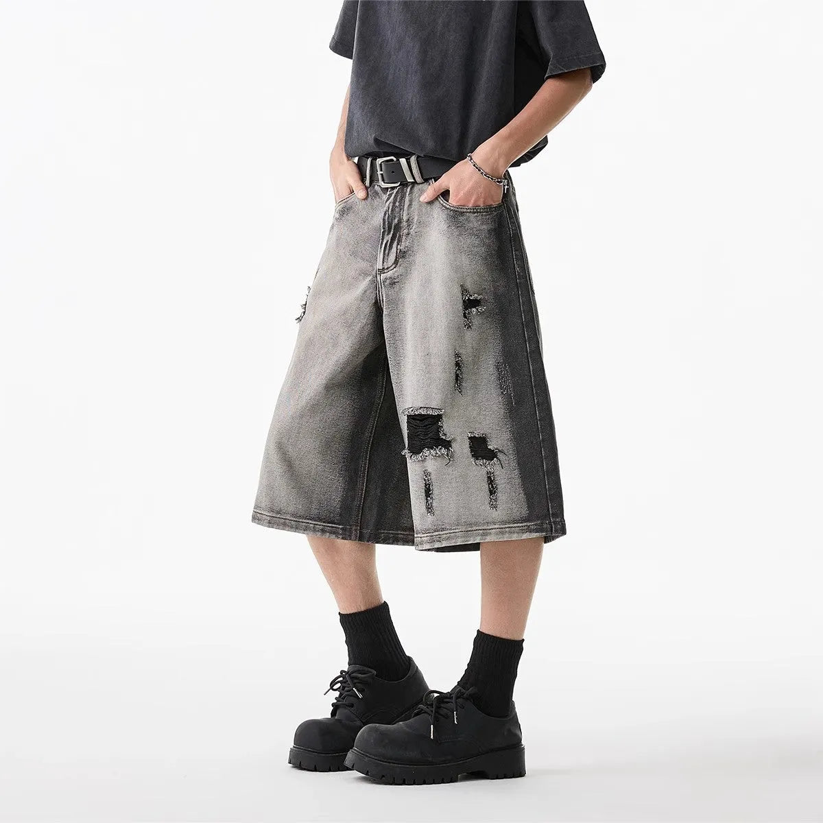 Gray water washed hole detail denim shorts with cropped length and loose fit