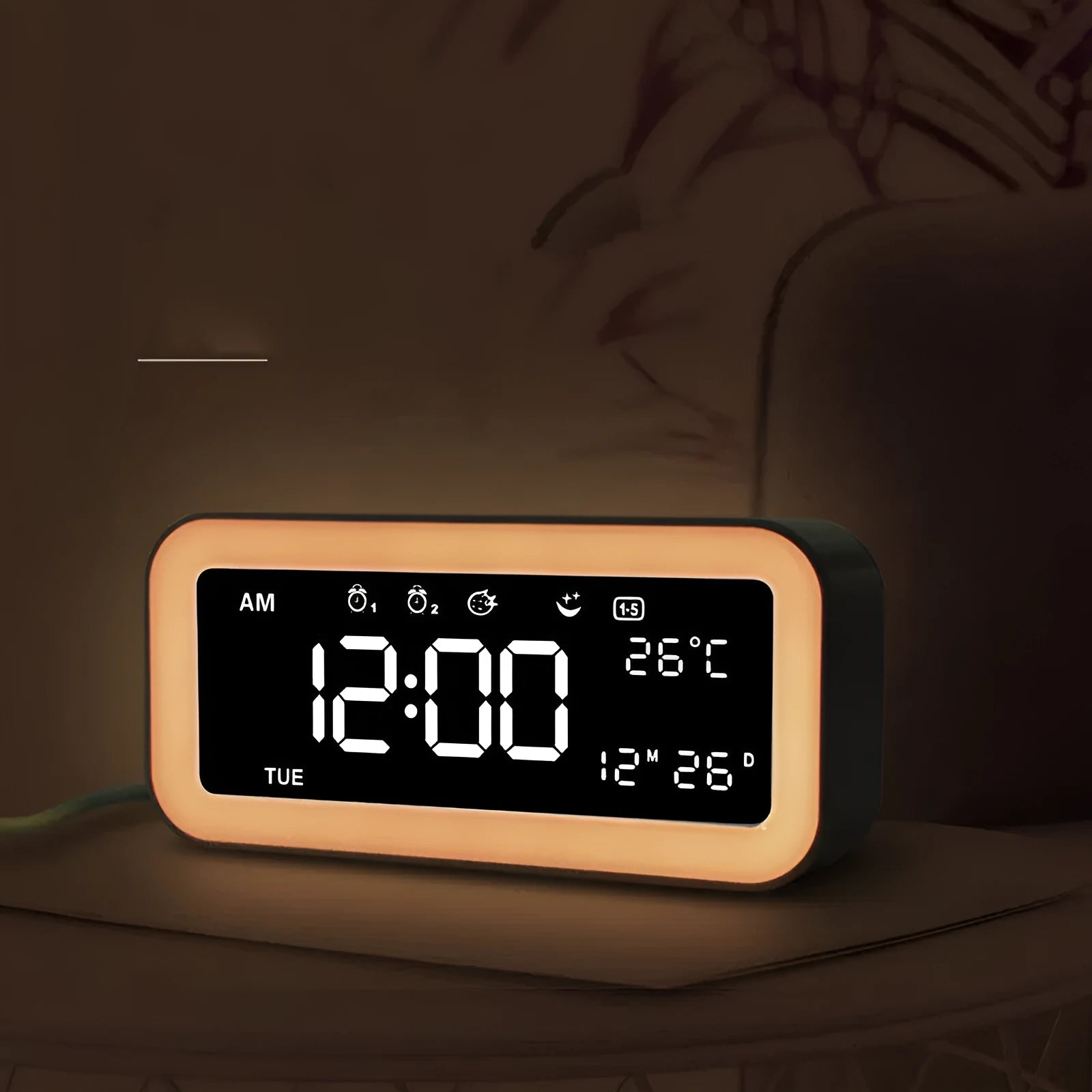 Blue rectangular LED atmosphere light alarm clock with digital display on a desk.