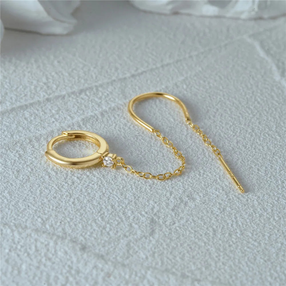S925 sterling silver flower-shaped earring with a dangling chain tassel in a gold colour finish.