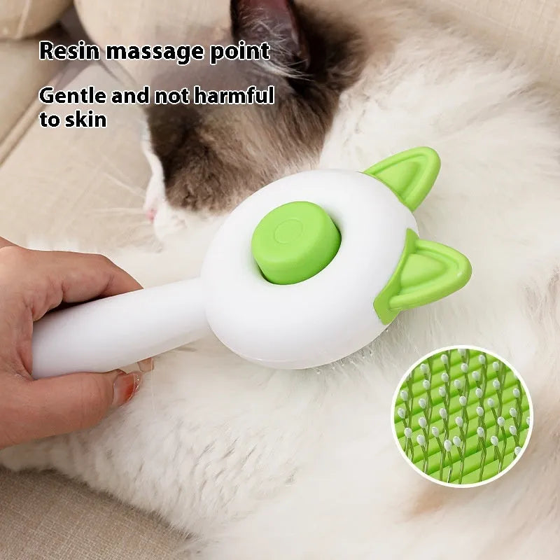 Self-cleaning cat grooming brush with stainless steel tines in greenish white colour