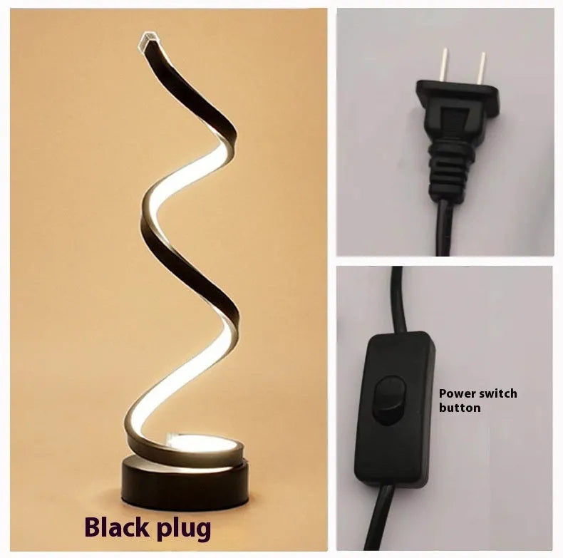 Minimalist black aluminium LED bedside table lamp on nightstand