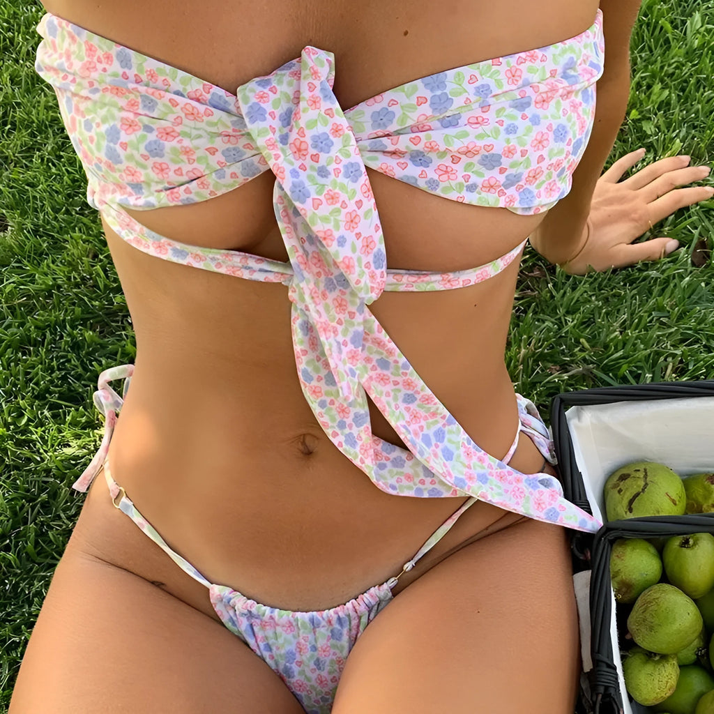 Women's green floral print swimsuit with lace-up front closure and high-leg split brief design