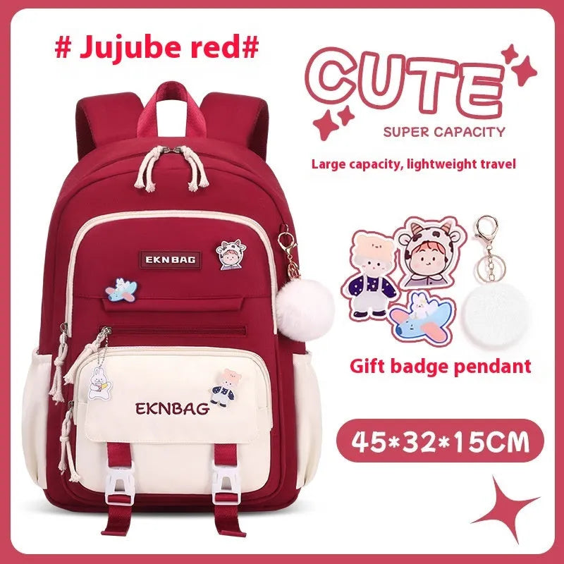 Pink waterproof Oxford cloth school backpack for girls with curved shoulder straps.