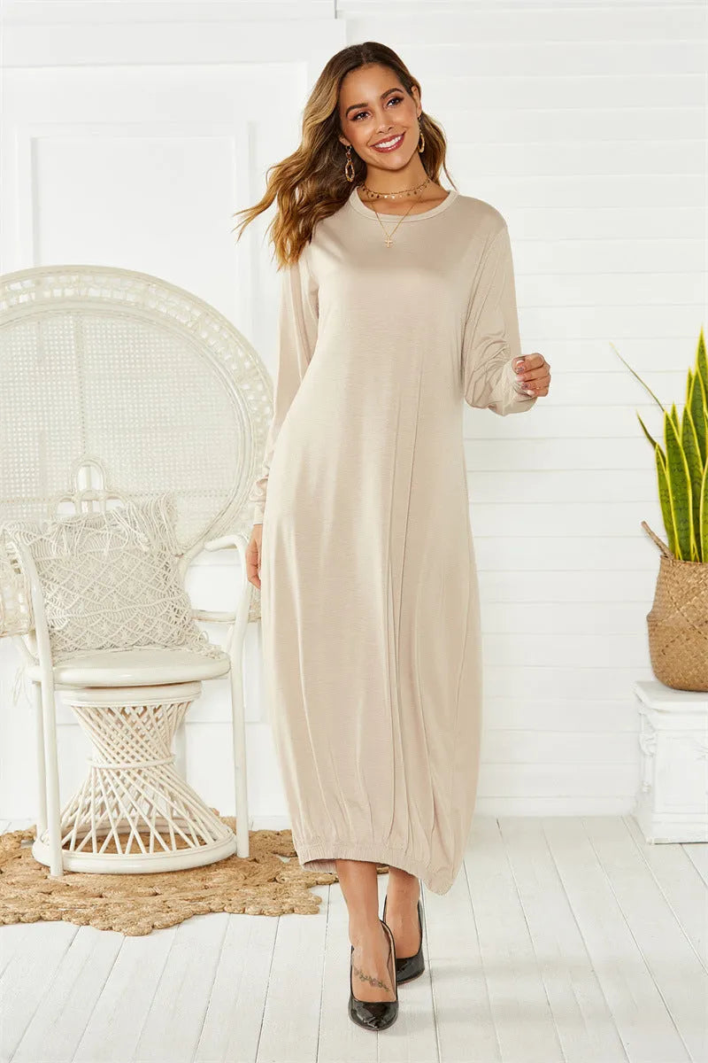 A loose-fitting black lantern dress for women with a lace-up crew neck.