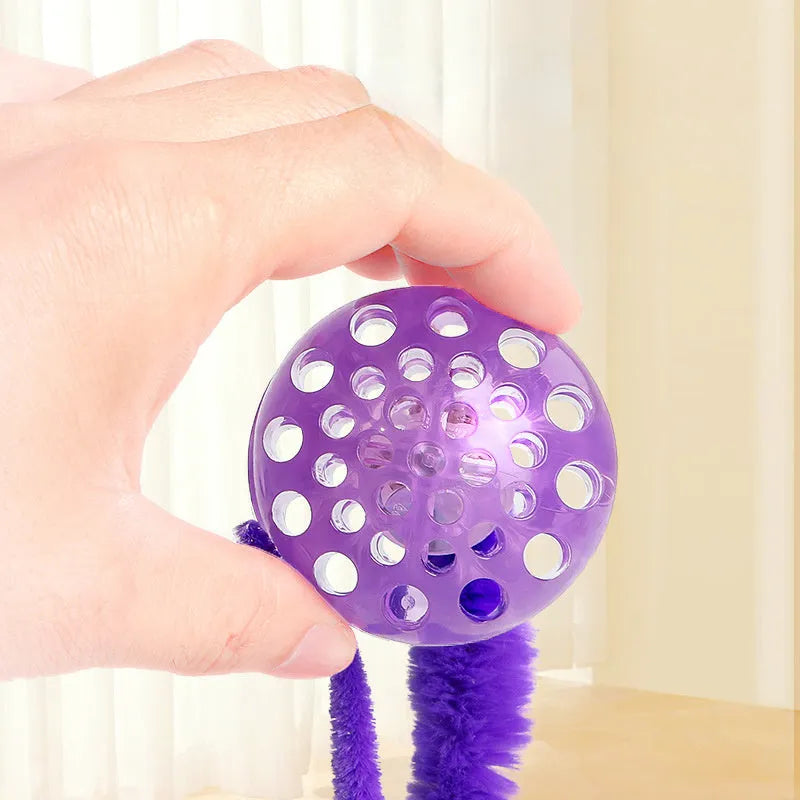 Interactive TPR bouncy ball cat toy with soft plush worm tail in green, pink or purple