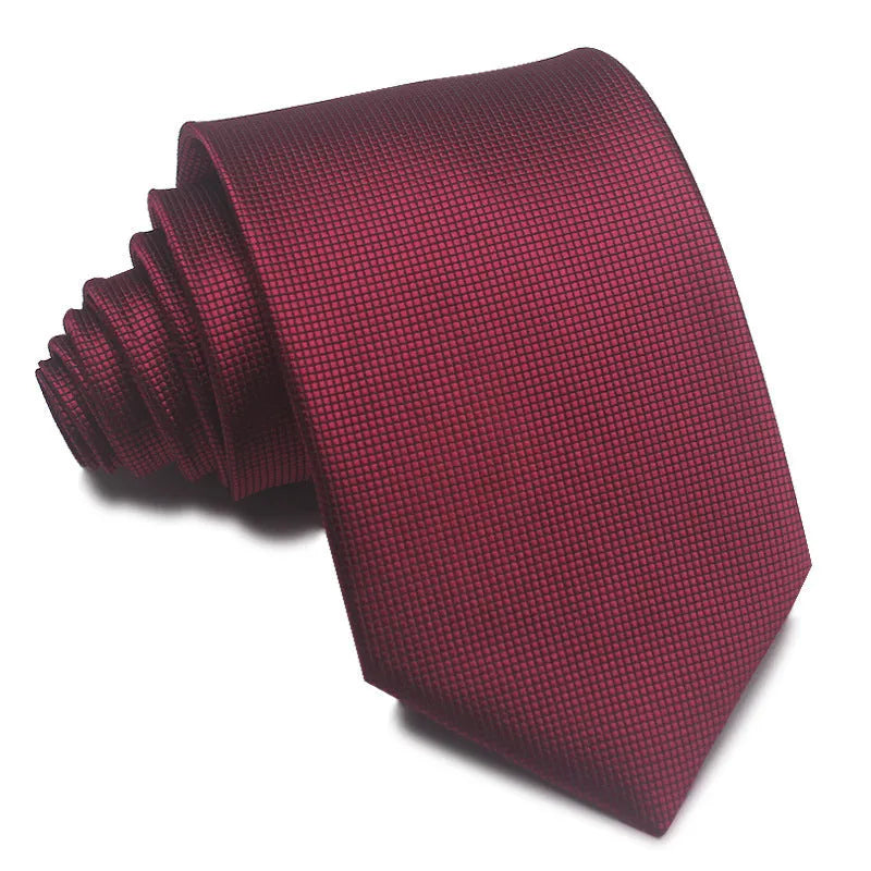 A man's striped formal tie in an arrow style, showing the jacquard texture and width of 7-8 cm.