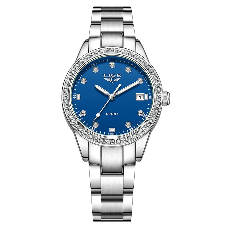 Silver fashion quartz watch with diamond markers on a 34mm stainless steel case and luminous hands.