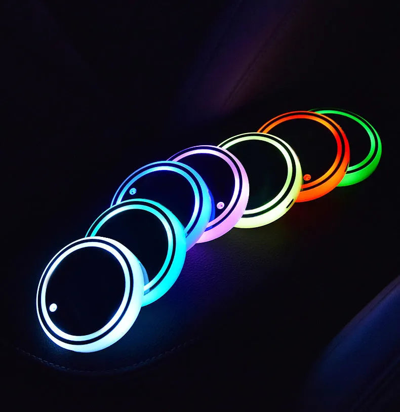 Colourful LED light-up coaster for car cup holder with non-slip surface and USB cable.