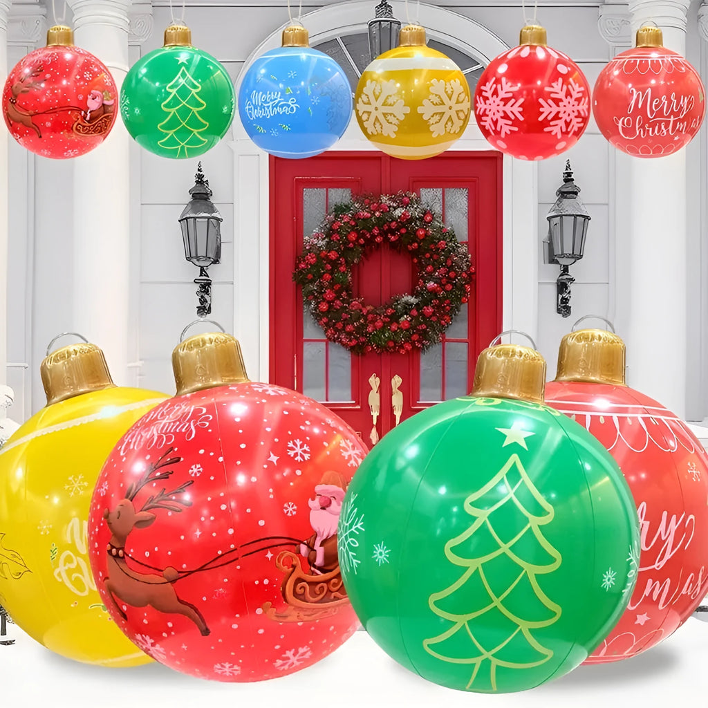 Large red and white inflatable Christmas ball with flashing lights in a garden setting