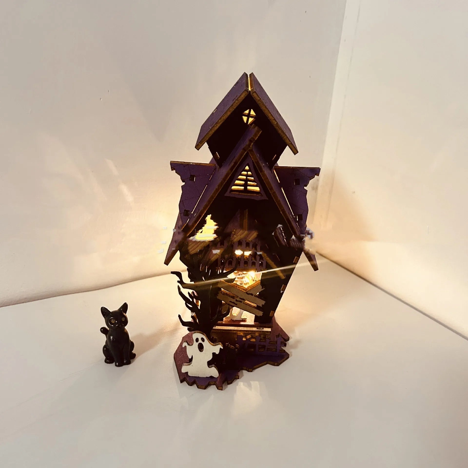 DIY wooden Halloween haunted house decoration kit with luminous design, shown with dimensions 14cm wide by 19cm high.
