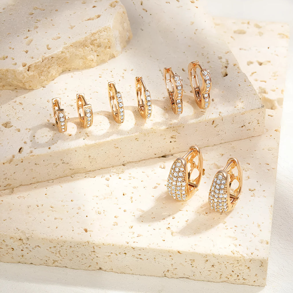 Gold plated heart shape clip earrings with cubic zirconia stones, shown in champagne gold tone colour