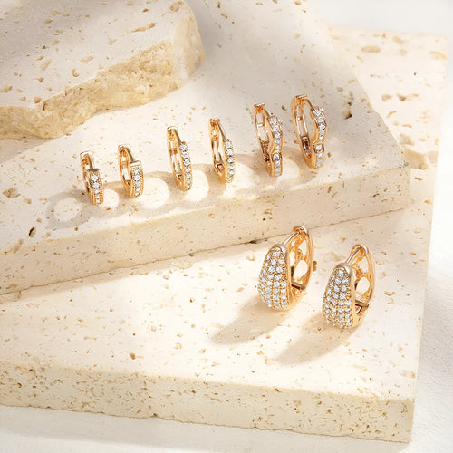 Gold plated heart shape clip earrings with cubic zirconia stones, shown in champagne gold tone colour