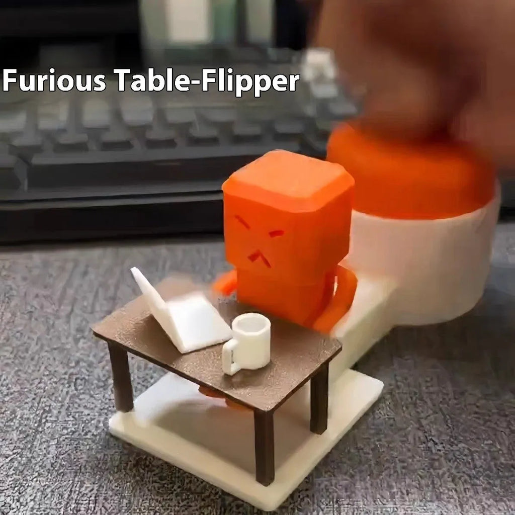 Orange plastic decompression toy with table-turning mechanism on flat surface