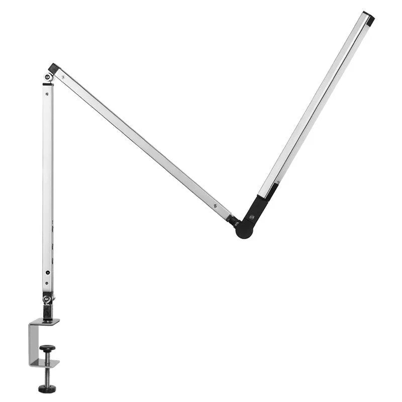 Adjustable LED desk lamp with clip attachment in black finish on wooden desk