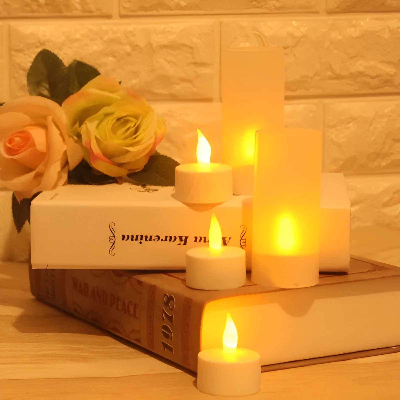 White plastic USB rechargeable LED candle lamp showing yellow glowing flame.