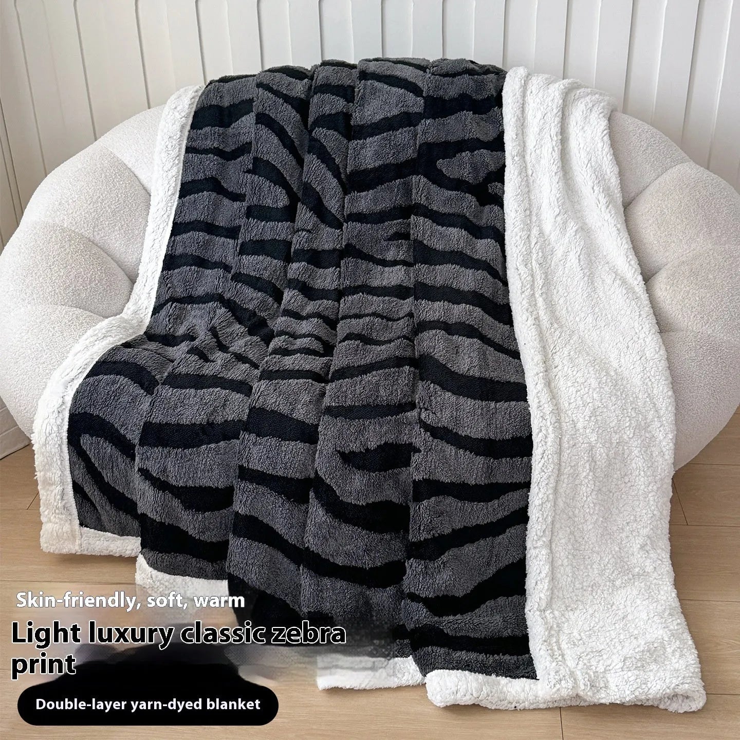 Double-layer cationic leopard jacquard taffeta blanket showing reversible design with zebra pattern