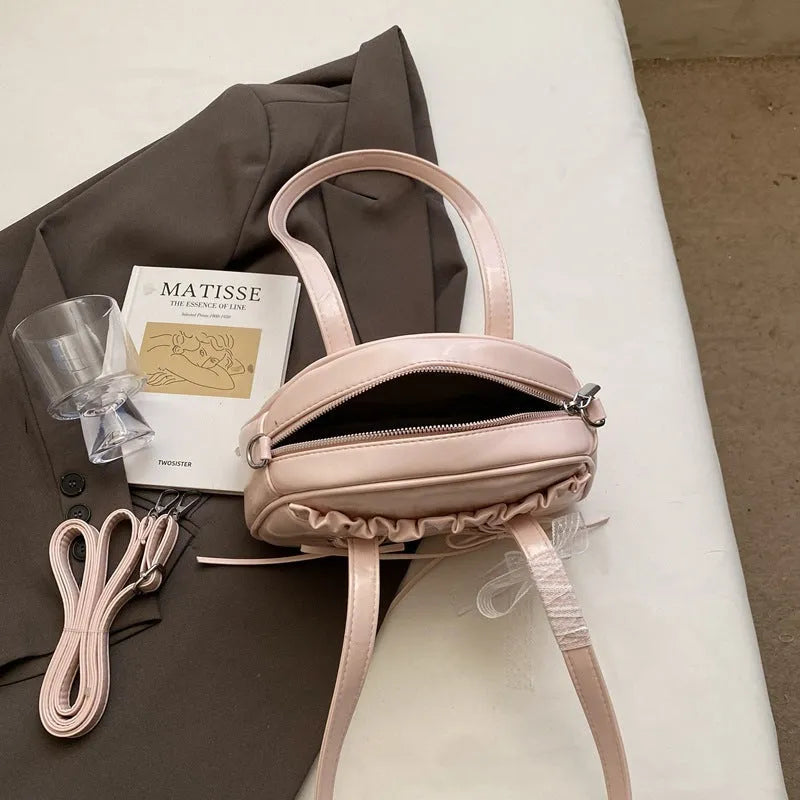 Women's fashion handbag with bow and bandage styling in PU leather, casual shoulder bag design
