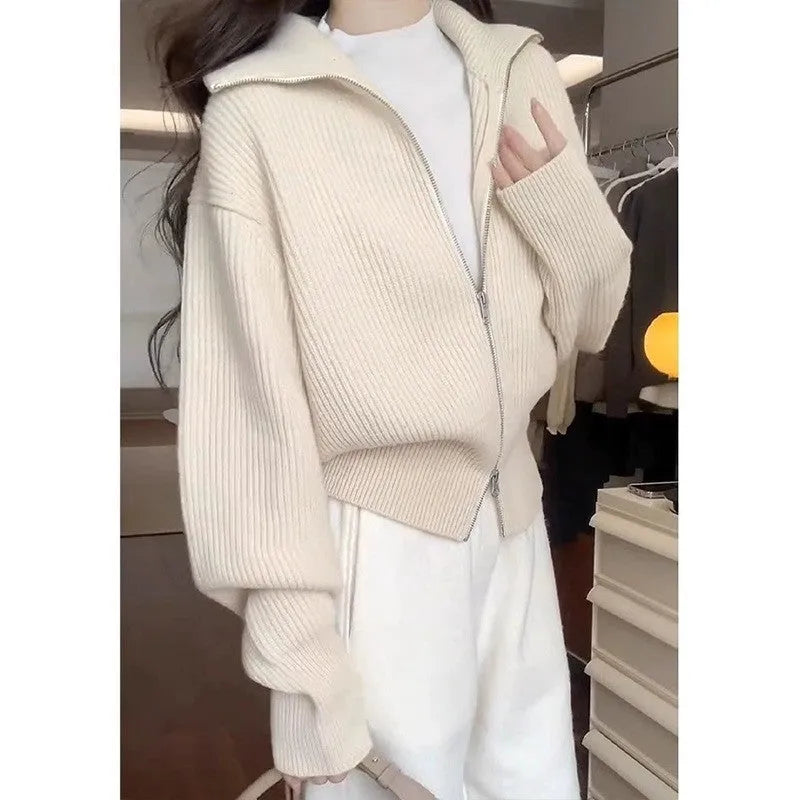 Grey Hong Kong style double zipper knitted cardigan with floral pattern on a hanger.