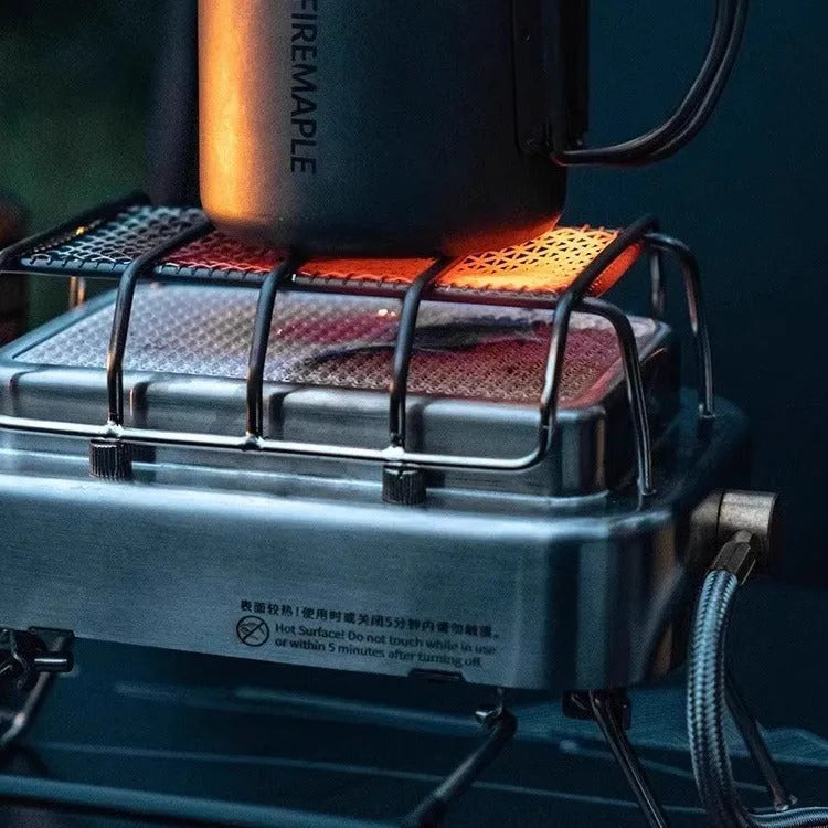 Outdoor heating stove with voltage regulator showing metal construction and compact folded design