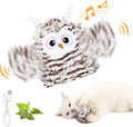 Grey automatic owl cat toy with flapping wings on a flat surface