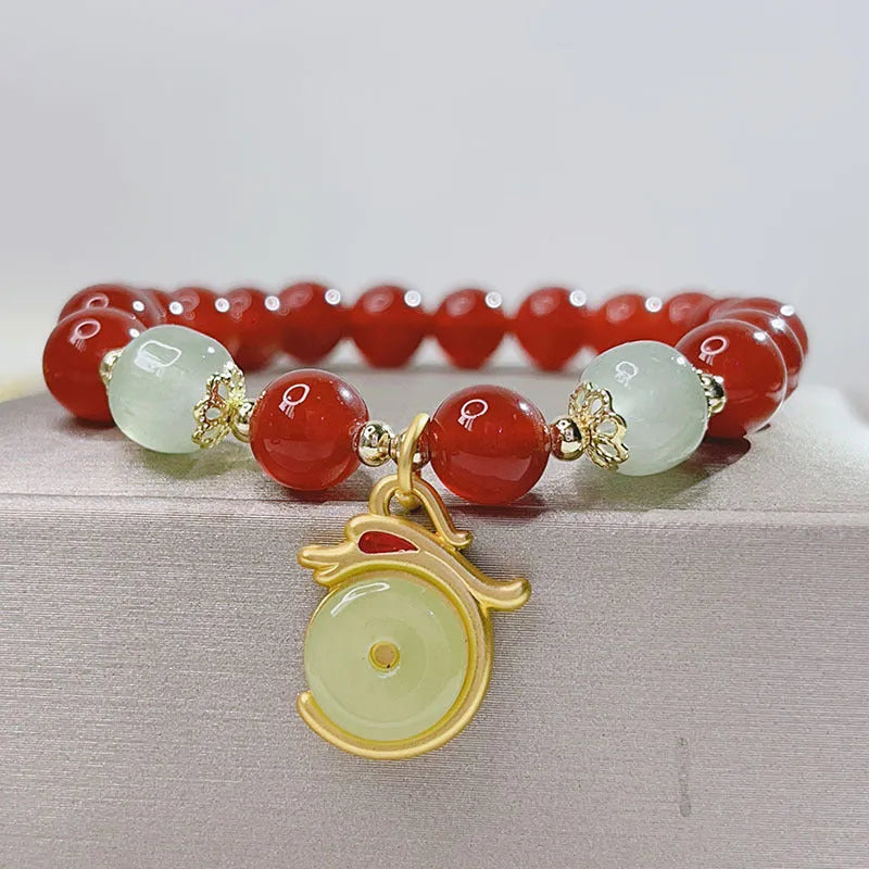 Chinese style red agate bracelet for women with dragon design, manual craftsmanship.