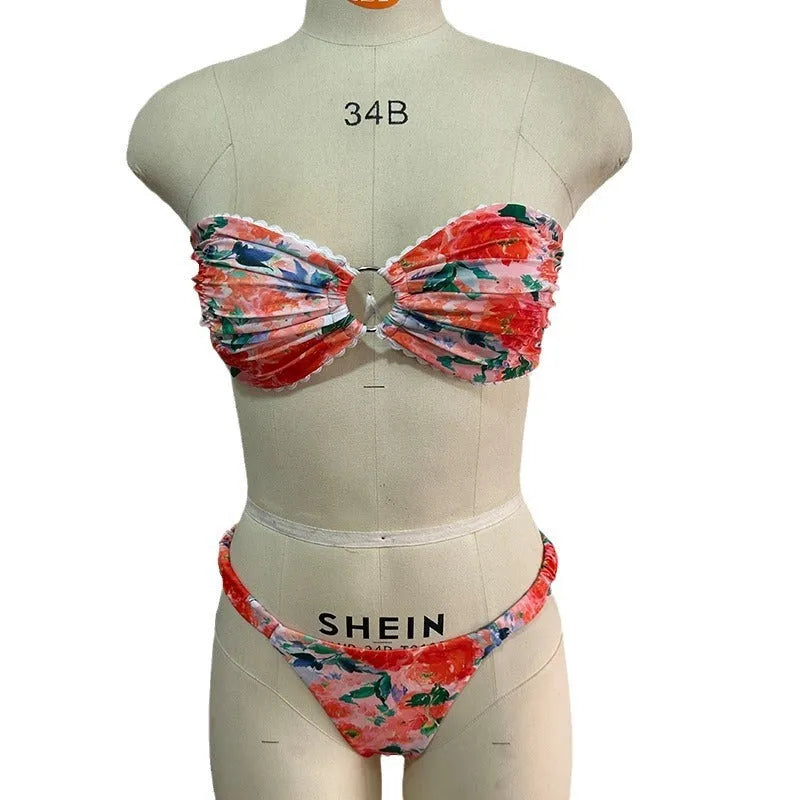 Blue floral print bikini set with lace trim on a sleeveless tube top and matching briefs.