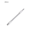 Silver metal flexible shaft extension for cordless drills with 6.35mm shank on a workbench.