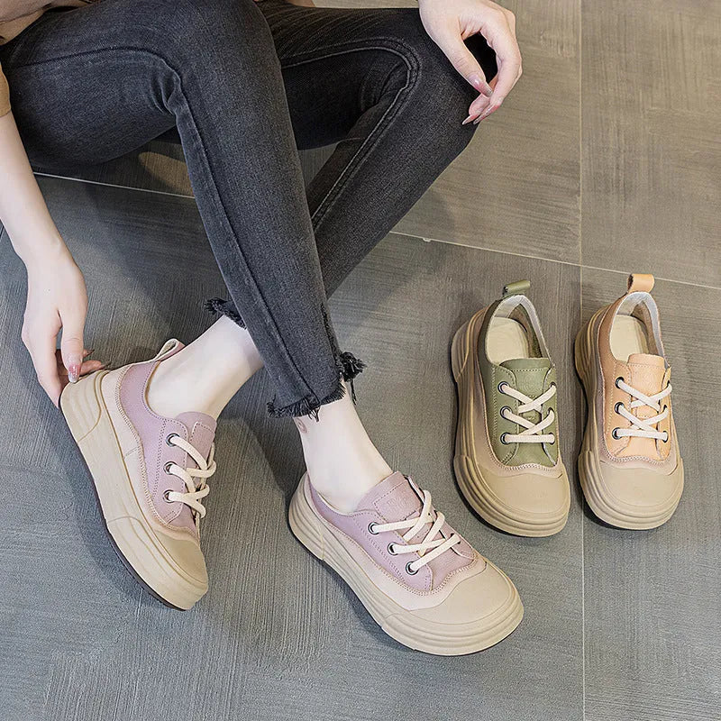 Women's matcha green leather platform sneakers with round toe and white laces on a flat sole.