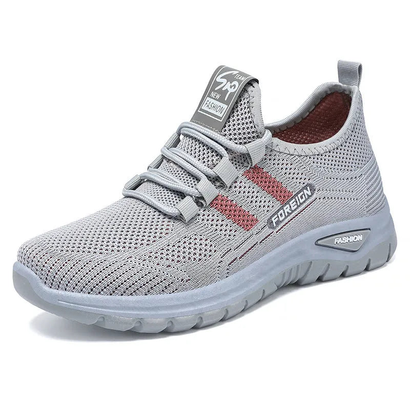 Women's low-top casual sneakers in black with breathable mesh upper and flat PVC sole