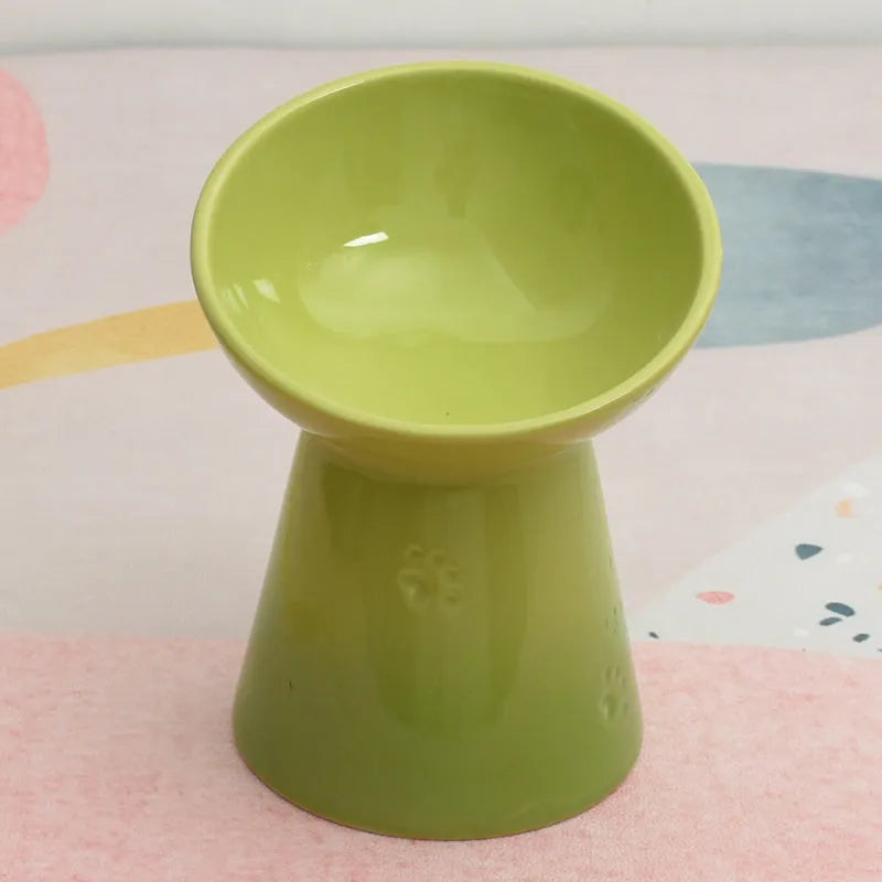 White ceramic pet bowl with a high foot neck and slanted rim for cat or dog feeding