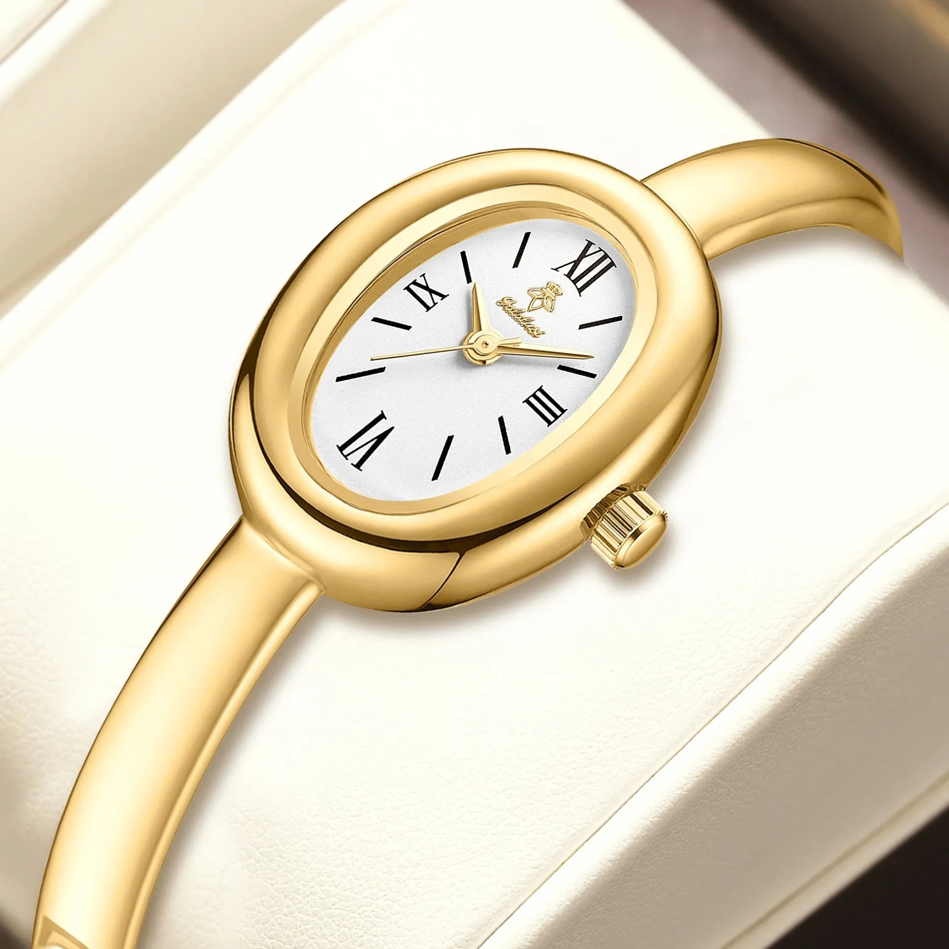 Women's oval retro quartz watch in gold with spiral pattern and slim 8mm profile